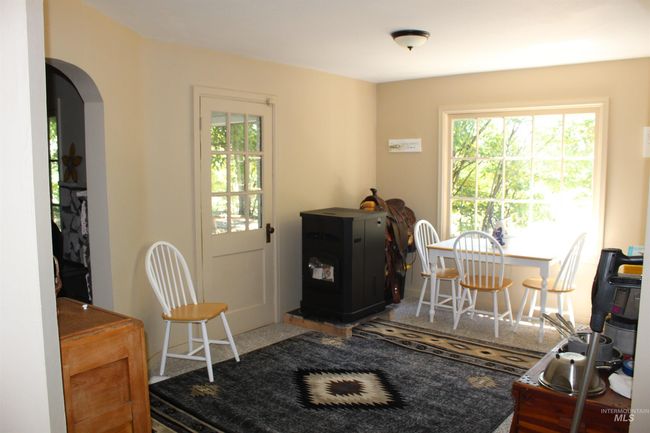 Dining room featuring healthy amount of natural light and arched walkways | Image 7