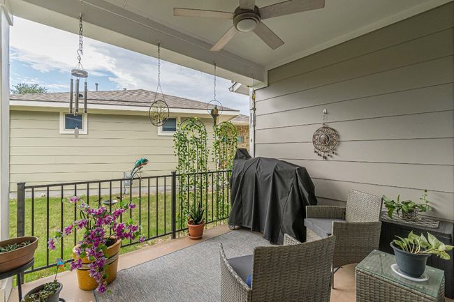 View of patio featuring a ceiling fan and a grill | Image 22