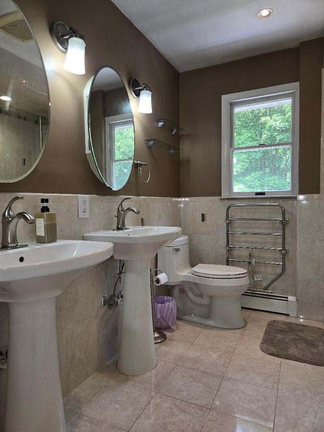 2nd Floor Bathroom featuring nicely tiled walls, radiant heated ceramic flooring and Heated Towel Rack! | Image 24