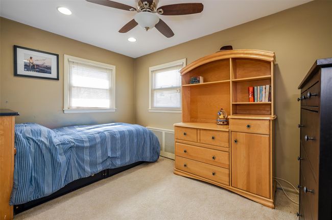 Bedroom featuring visible vents, recessed lighting, a ceiling fan, and light carpet | Image 11
