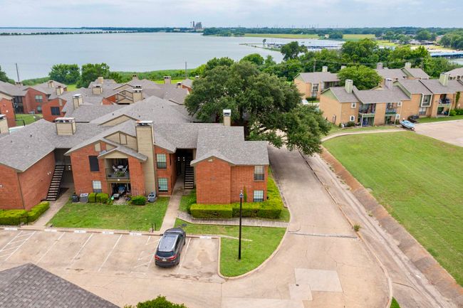 Aerial perspective of suburban area featuring a large body of water | Image 6