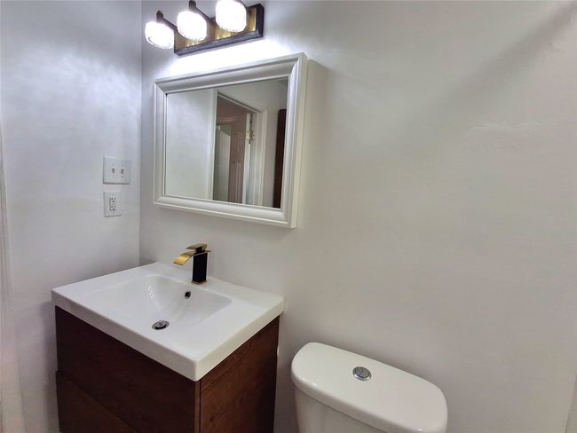 Bathroom featuring vanity and toilet | Image 17