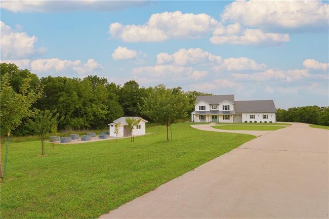 View of grassy yard and garden with an outbuilding. Perfect she/he shed! | Image 4