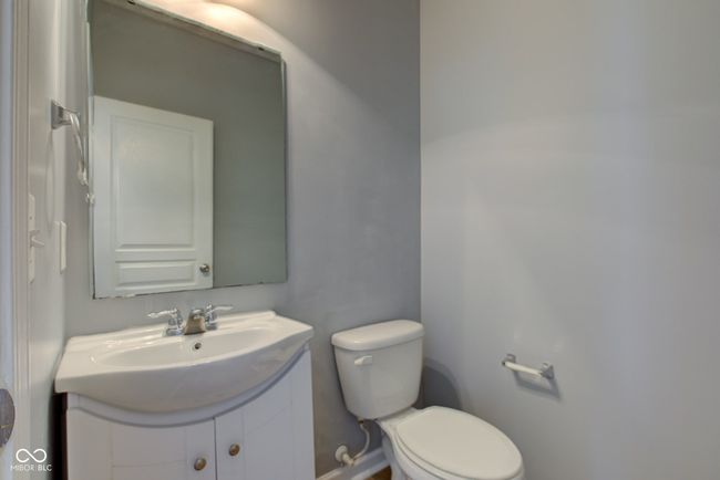 bathroom featuring toilet and vanity | Image 19