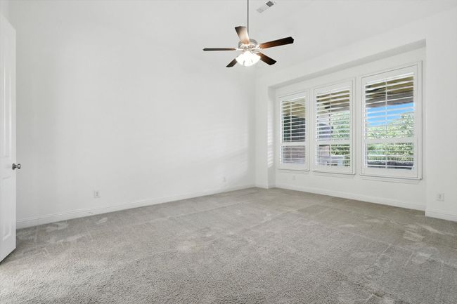 Spare room featuring carpet floors and a ceiling fan | Image 17