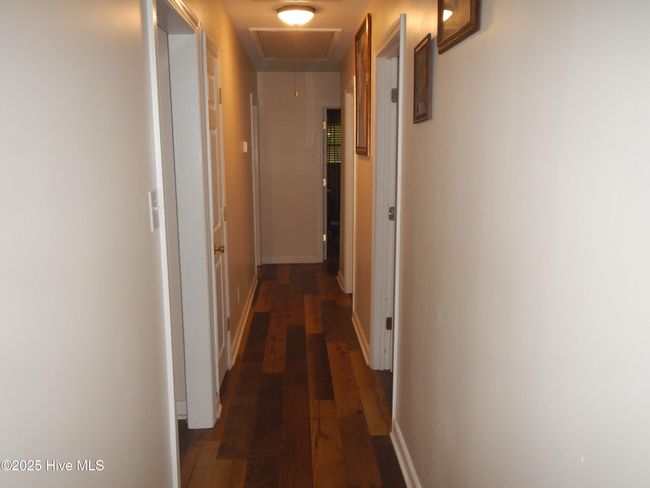 Hallway from kitchen side. Attic access on kitchen in | Image 13