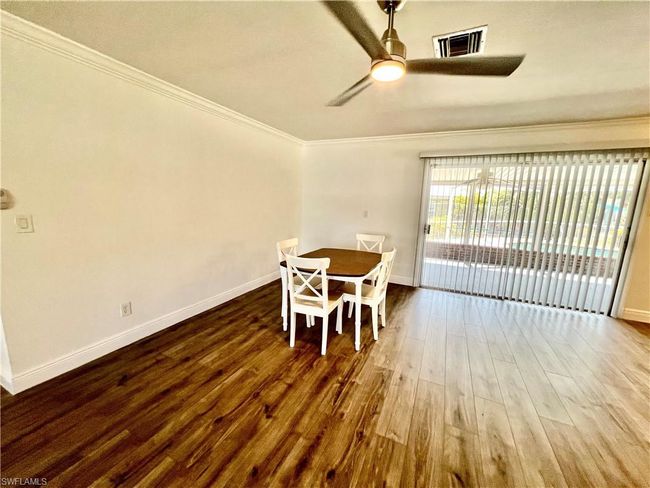 Dining area with LUXURY VINYL PLANK FLOORS. | Image 16