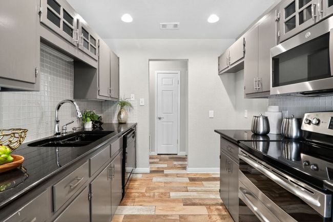Galley Kitchen with Stainless Steel Appliances | Image 10