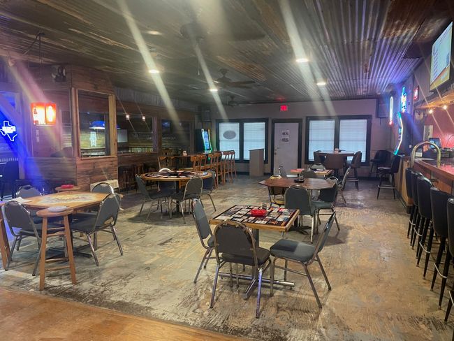 Dining area with concrete flooring and a ceiling fan | Image 11