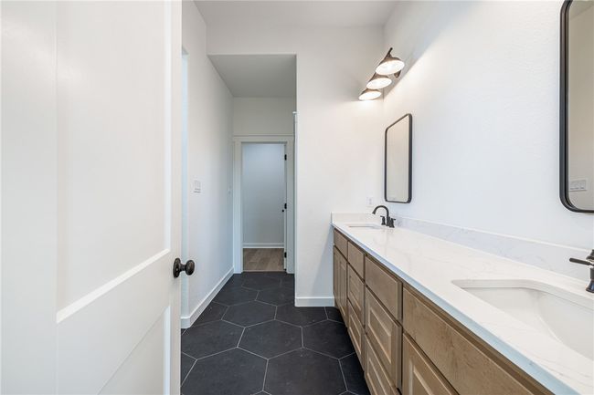 Bathroom featuring vanity and tile patterned floors | Image 16