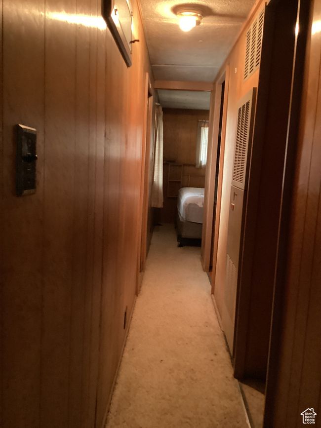 Hallway featuring light carpet | Image 18