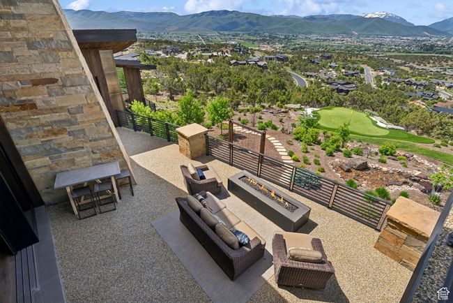 View of patio / terrace featuring a mountain view and an outdoor living space with a fire pit | Image 105