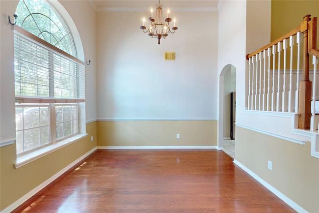 Grand entry dining room, with high ceilings, and 2 tone paint | Image 5