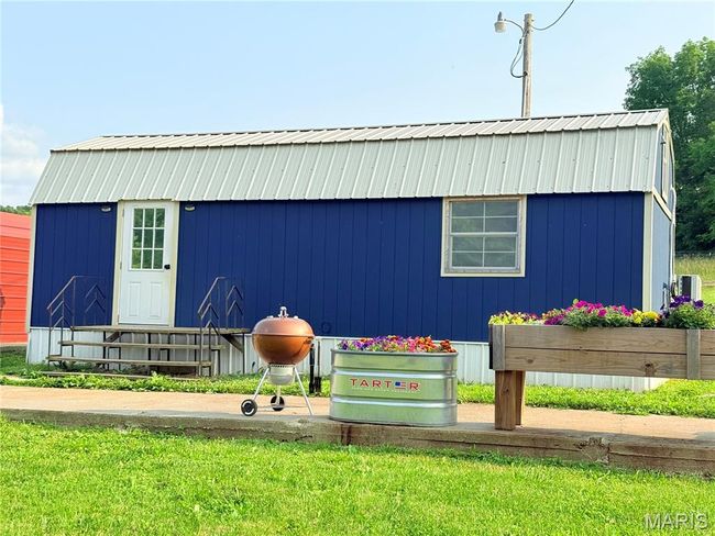 View of outdoor structure with entry steps | Image 65