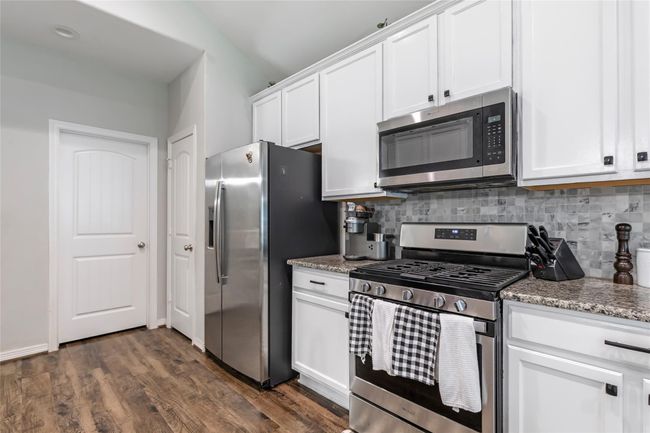 New hardware and bright white cabinets. | Image 17