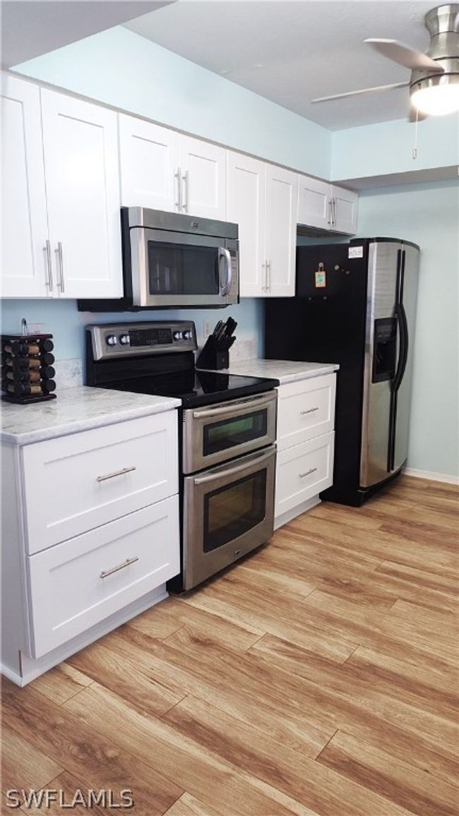 Spacious kitchen with SS appliances and new granite counters/cabinets. | Image 9