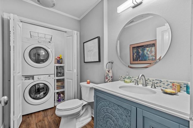 MAIN: Nicely finished half bathroom with stacked w/d | Image 23