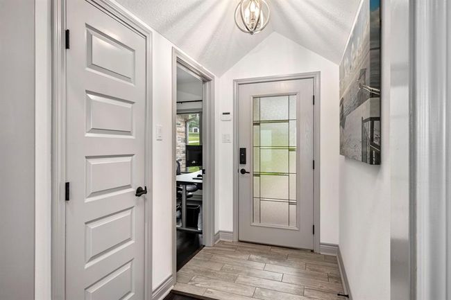 Guests are greeted by a lovely tiled formal entrance, chandelier & Glass Front Entry Door. | Image 4