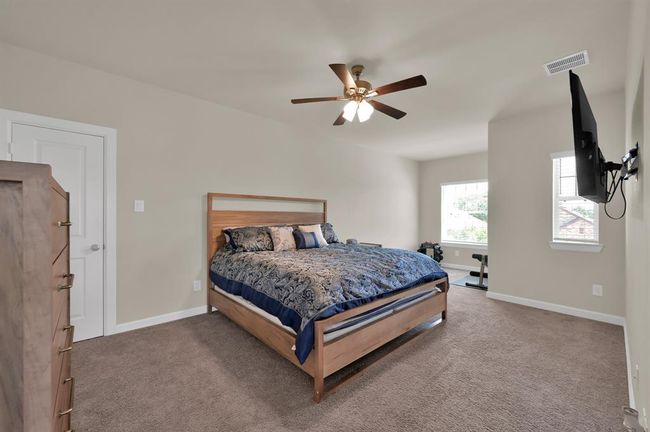 Bedroom 3 also faces the front of the home and includes an extended space perfect for a small workout space or study desk. This is the largest room upstairs. | Image 23