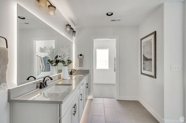 Full bathroom featuring double vanity and tile patterned floors | Image 8