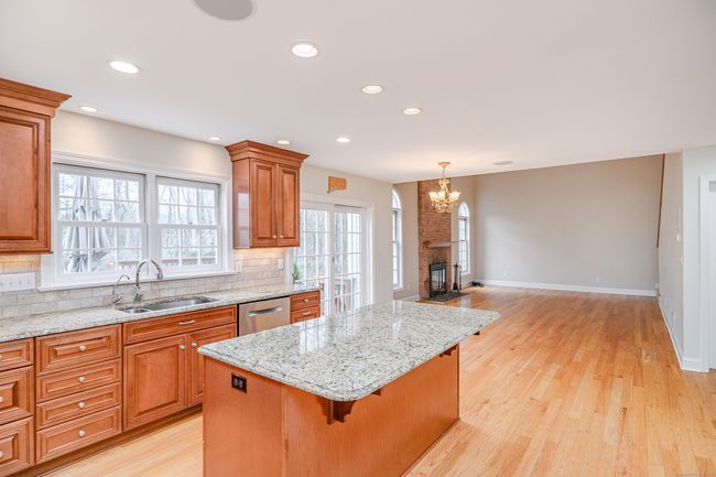 Chef's kitchen with island. | Image 8