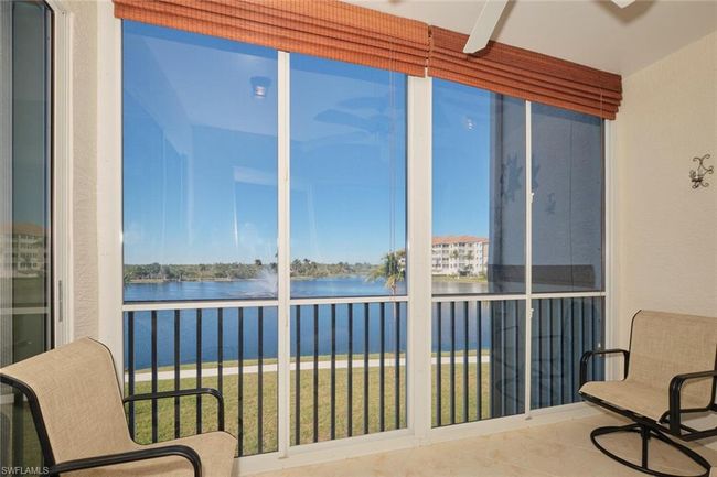 Sunroom with a water view | Image 7