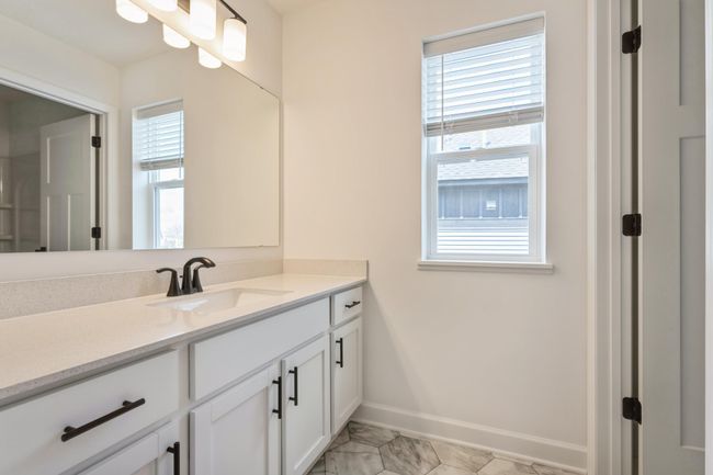 Photo is of the actual home. The secondary bath! | Image 14
