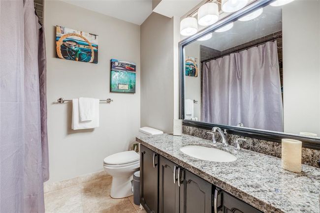 Bathroom 2 with granite counters, bath with shower, travertine floors | Image 24