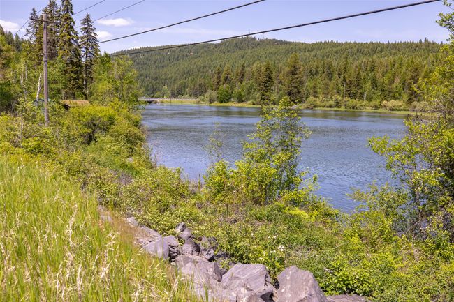 Water view featuring a heavily wooded area | Image 113