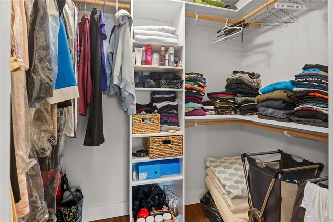 Spacious closet featuring wood finished floors | Image 39