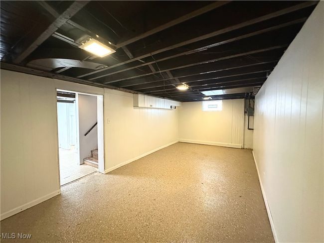 Basement with stairway and baseboards | Image 13
