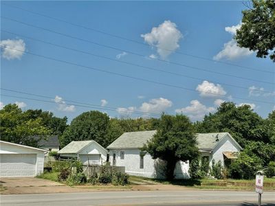 View of front of property with a garage | Image 1