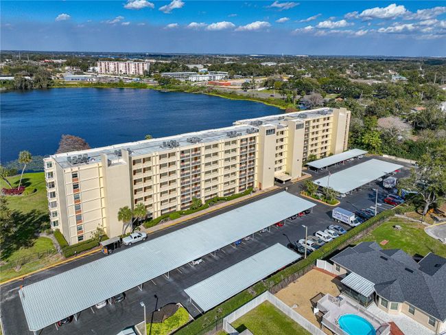 AERIAL VIEW OF CONDO, PARKING AREA, SPRING LAKE & VIEW TOWARDS NE | Image 55