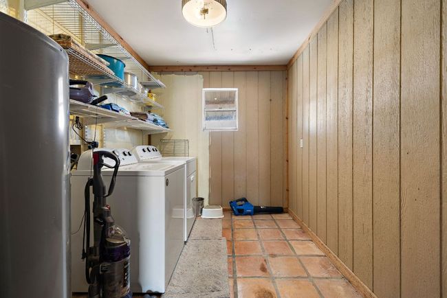 Clothes washing area featuring laundry area with washer and dryer | Image 25