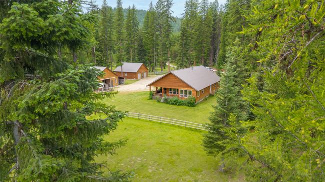 Aerial view of property and surrounding area featuring a forest | Image 17