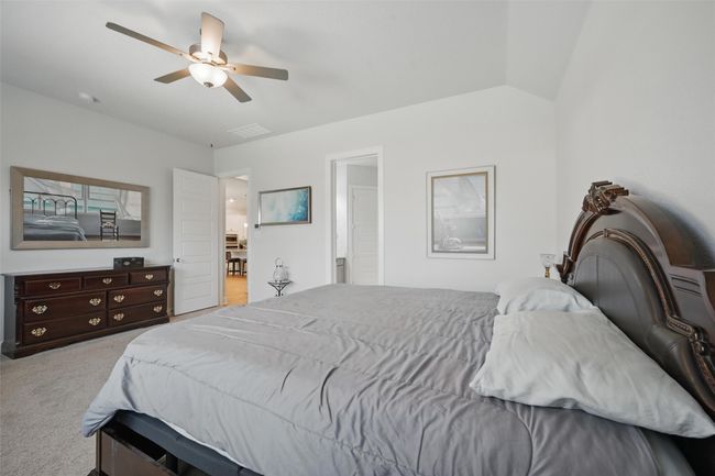 Carpeted bedroom featuring ceiling fan | Image 14