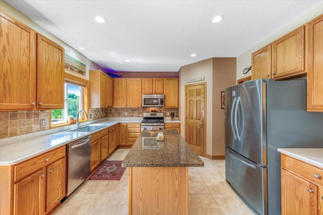 Walk in corner pantry, and huge center island! | Image 12