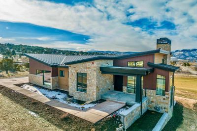 Rear view of house featuring a mountain view | Image 1