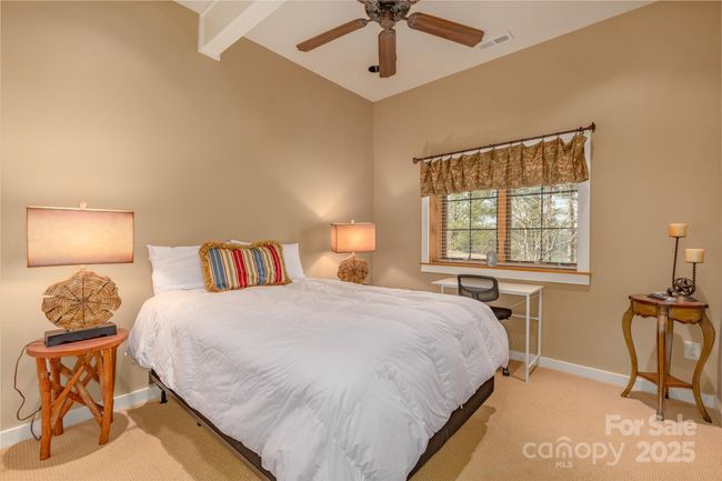 A private balcony extends off the suite, offering a serene spot to enjoy morning coffee or unwind while taking in scenic views. | Image 16