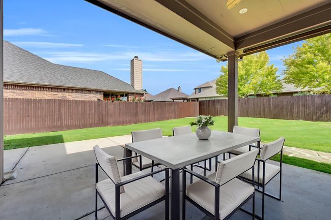 Fenced backyard with outdoor dining area and a patio area | Image 30