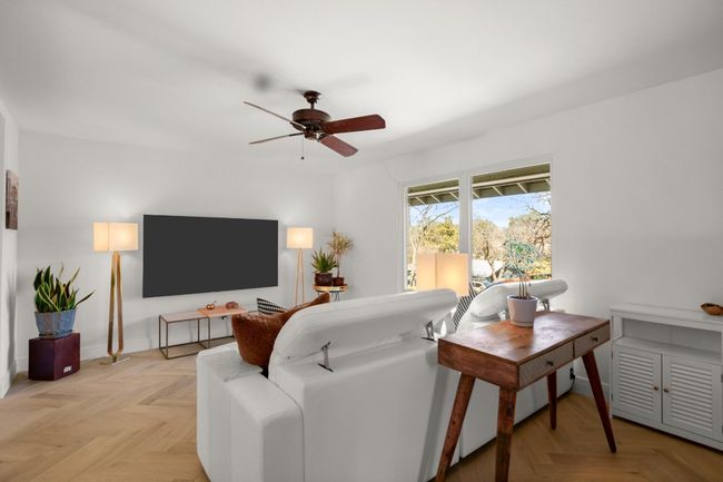 Living area featuring ceiling fan and baseboards | Image 11