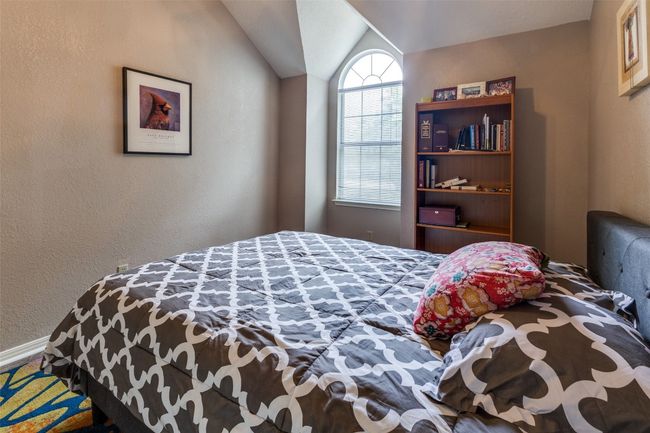Vaulted ceilings, arched window, light and cozy. | Image 31