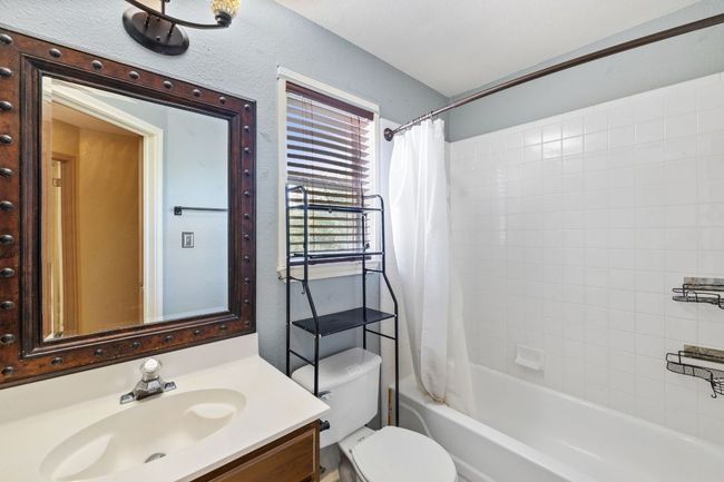 Bathroom with vanity and shower / bath combo with shower curtain | Image 22