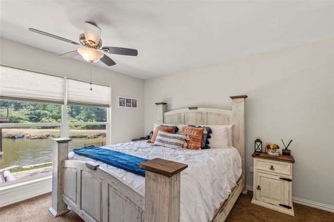 Main home primary en suite waterside bedroom | Image 27