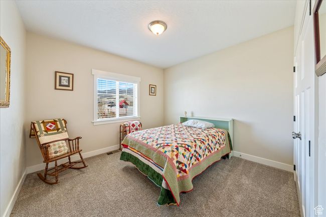 Bedroom with carpet flooring and baseboards | Image 29