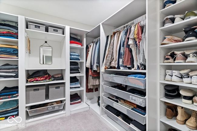 walk in closet with carpet floors | Image 26