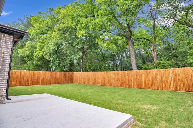 Fenced backyard featuring a patio area | Image 26