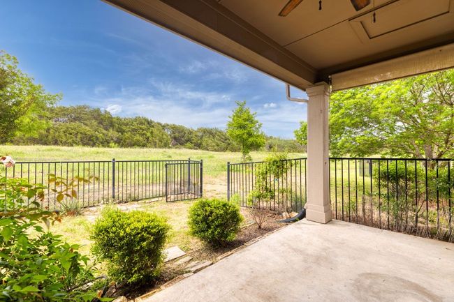View of patio with ceiling fan | Image 29