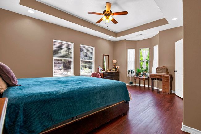 Lots of windows in master bedroom! | Image 17