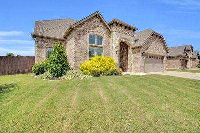 View of front of property featuring a garage and a front yard | Image 2